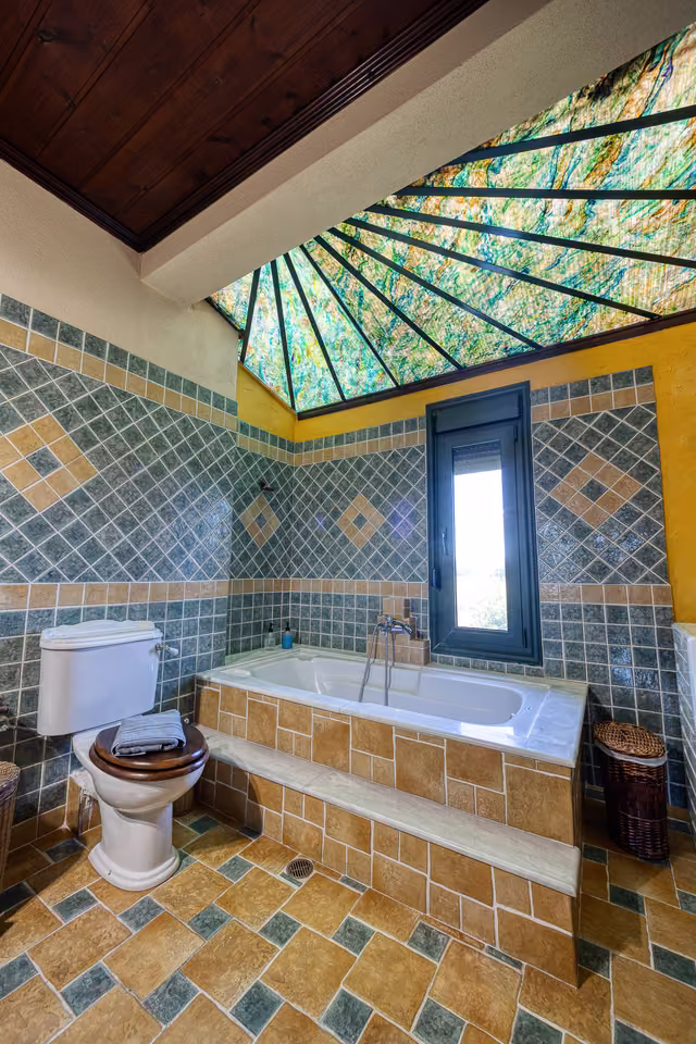 Bathroom with stained-glass skylight